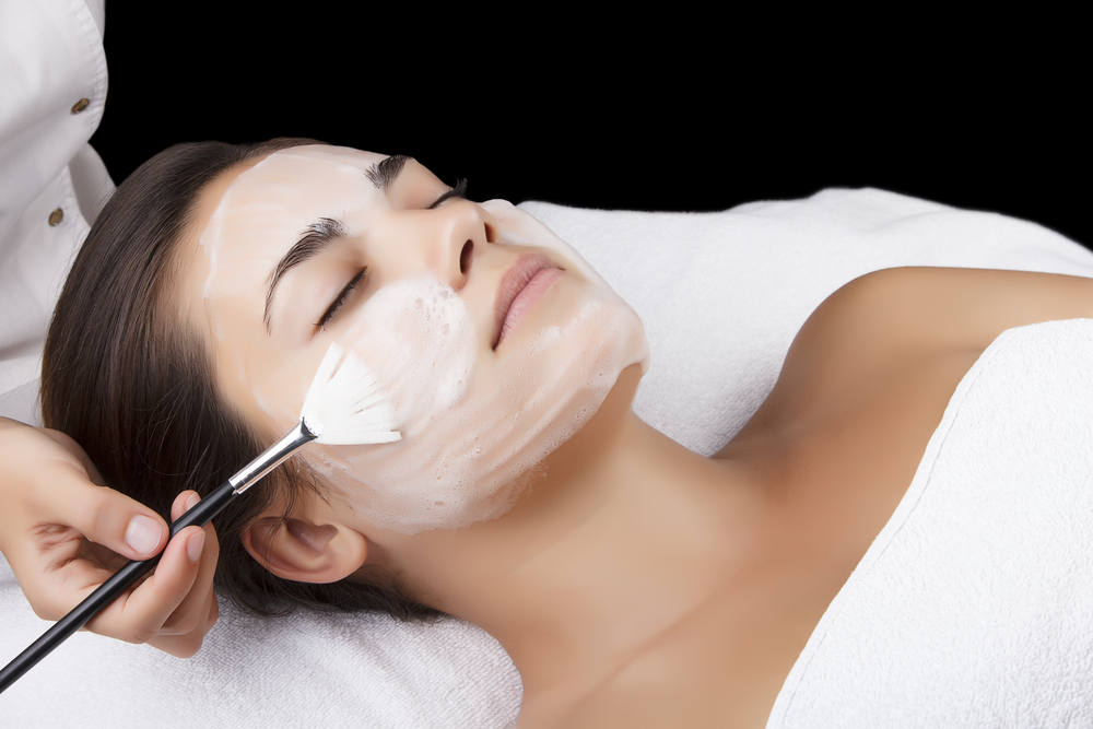 Lady getting a facial peel