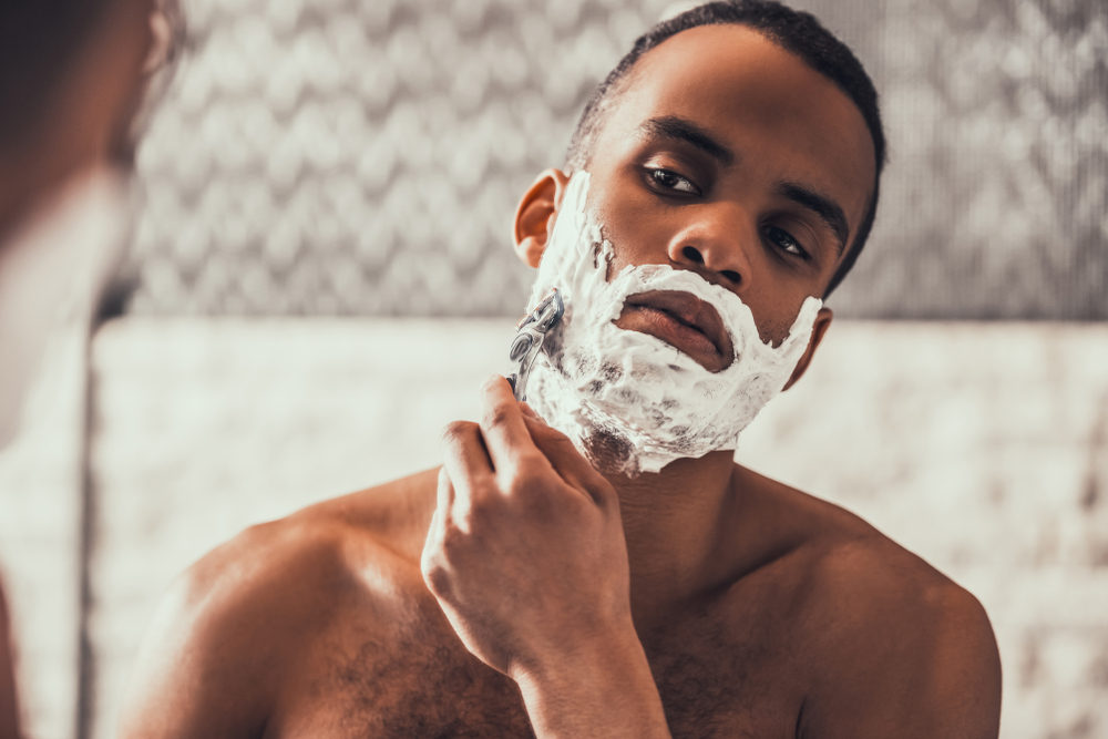 Man shaving beard