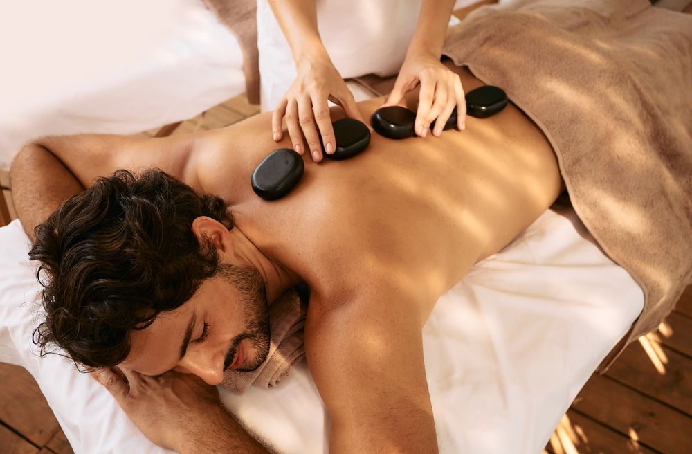 Man enjoying a hot stone massage